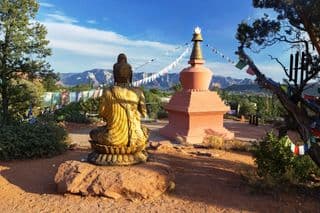 Golden Buddha Statue in Meditation at Amitabha Stupa