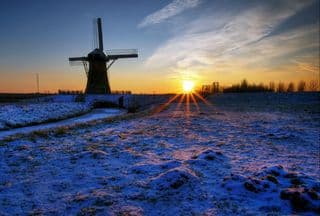 Snow-Kissed Windmill at Sunset