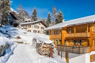 Snow-covered Wooden Chalet in Davos
