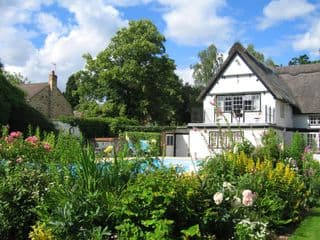 Thatched Cottage Garden in Hemingford Abbotts, England