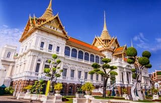 Thai Grand Palace Splendor Under Blue Skies