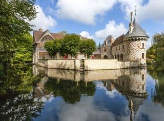 Reflection of Saint Germain de Livet Castle in Moat