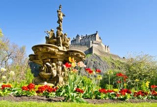 Edinburgh Castle and the Golden Greyhound Fountain in Spring