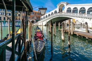 Gondolas moored at Rialto Bridge in Venice