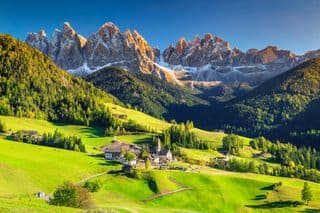 Sunlit Alpine Village in the Dolomites