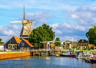 Traditional Dutch Windmill by the Canal