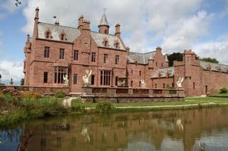 Gothic Revival Castle Reflecting in Pond