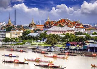 Traditional Thai Royal Barge Procession at the Grand Palace
