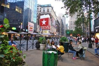 People Dining Outdoors Near Macy's in Herald Square, New York City