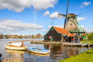 Traditional Dutch Windmill by the Water