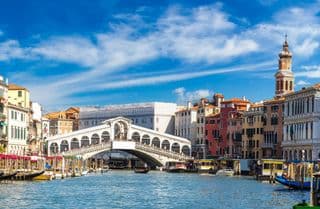 Rialto Bridge in Venice Under Blue Skies