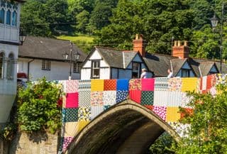 Colorful Patchwork Quilt Bridges Over River Dee