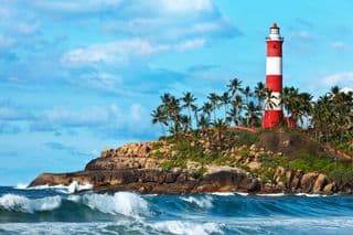 Coastal Lighthouse amidst Palm Trees