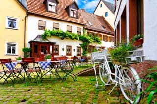 Cobblestone Cafe Courtyard in Old Town Amorbach, Bavaria, Germany