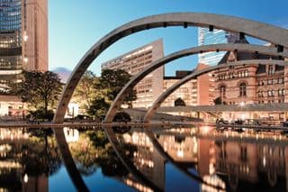 Modern Arches Reflect in the Evening Waters of Toronto