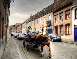 Horse-drawn Carriage in an Old European Street
