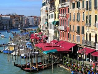 Gondolas docked at Rialto Bridge in Venice