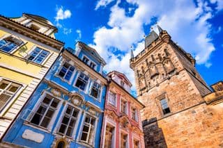 Vibrant facades of Prague's Old Town under the blue sky