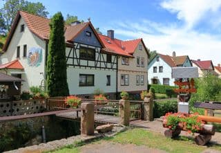 Half-Timbered Houses Nestled by the Stream