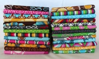 Stack of Vibrant Fabric Rolls