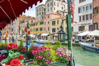 Flower-adorned Cafe by the Grand Canal in Venice, Italy