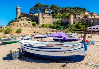 Boats Resting Under the Castle's Watch in Tossa de Mar