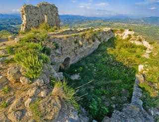 Ancient Stone Fortress atop Verdant Hills
