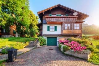 Traditional Alpine Chalet in Blossoming Spring