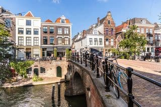 Bicycles Resting Along the Oudegracht Canal in Utrecht, The Netherlands