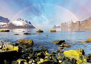 Rainbow Over Norway's Snow-Capped Mountains