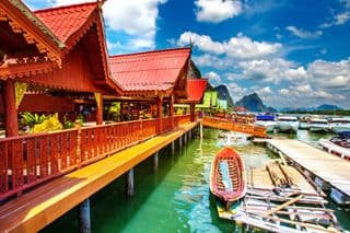 Traditional Thai Stilt Houses by the Sea