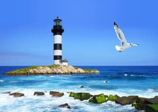 Striped Lighthouse by the Ocean Coast