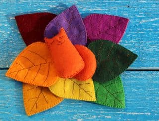 Handcrafted Orange Fox Nestled Amongst Vibrant Leaves