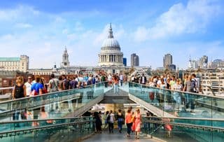 Throngs Crossing the Millennium Bridge in London