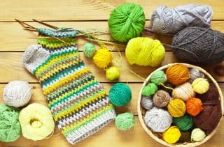 Vibrant Woolen Yarn Collection and Hand-Knitted Sock