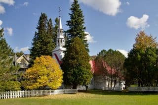 Traditional Church amidst Autumn Trees in Mont Tremblant, Quebec