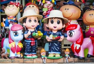 Colorful Statues of Thai Children and Ponies