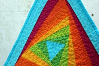 Vibrant Rainbow Triangle Quilt