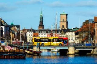 Yellow Bus Crossing Copenhagen Waterway