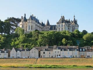 Overlooking the River: A Castle and Traditional Houses