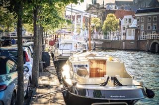 Boats Docked Along the River Spaarne in Haarlem, Holland