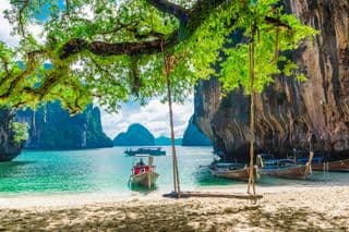 Swinging over the Emerald Waters of Koh Lao Lading Island