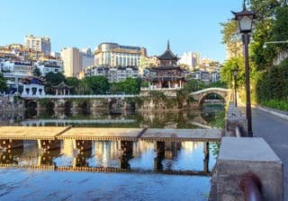 Traditional Chinese Pavilion amidst Modern Guiyang Cityscape