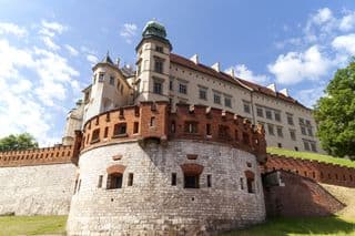 Wawel Royal Castle in Kraków Under Summer Sky