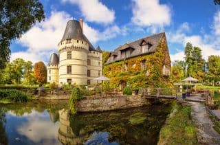 Medieval Castle amidst Lush Gardens in France