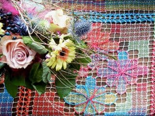 Colorful Floral Bouquet and Handwoven Mat