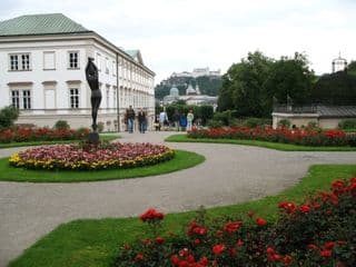 Statue amidst Blooms at Salzburg's Mirabell Palace Gardens