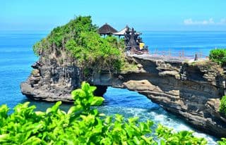 Traditional Balinese Temple Perched atop an Ocean Arch