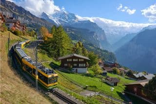 Yellow Train Journey Through Swiss Alps