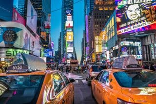 Yellow Cabs in Times Square at Dusk